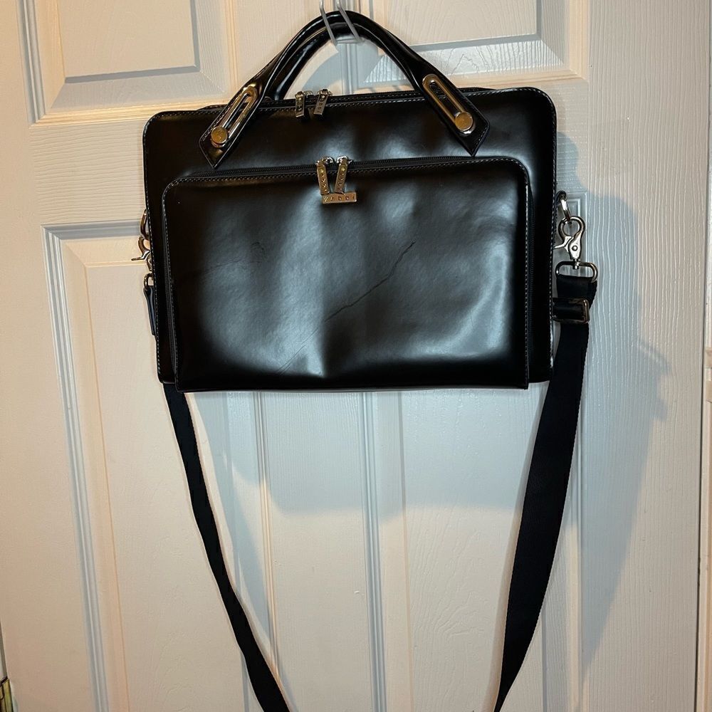 Abbi New York Laptop/Briefcase Carrier Black leather inside padded fabric.